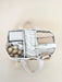 Organized diaper bag with baby items on a beige background