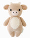 Knitted toy cow on a white background