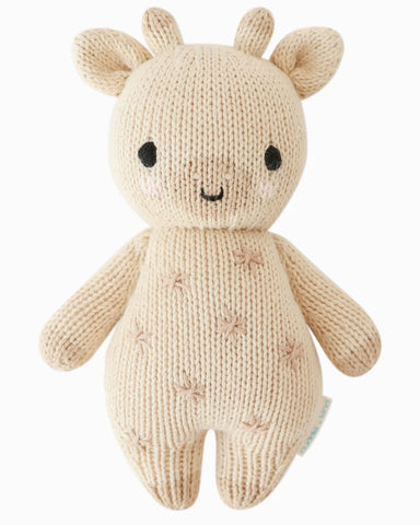 Knitted toy deer with a white background