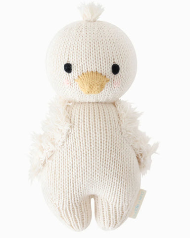 Knitted toy duck on a white background