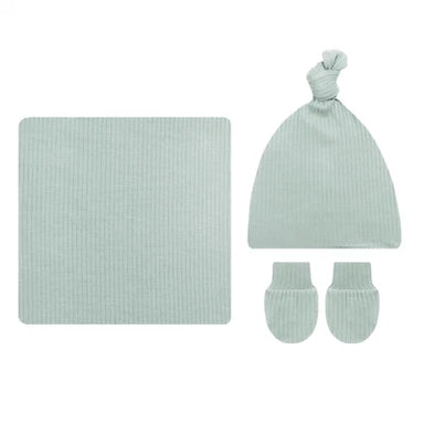 A baby knit gift set in a pale mint green ribbed fabric, including a square blanket, a knotted beanie hat, and a pair of mittens, arranged on a plain white background.