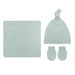 A baby knit gift set in a pale mint green ribbed fabric, including a square blanket, a knotted beanie hat, and a pair of mittens, arranged on a plain white background.