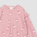 up close view of pink sweatshirt with ruffle detail on sleeve and all over ballerina print