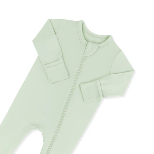 Light green baby onesie with a zipper on a white background