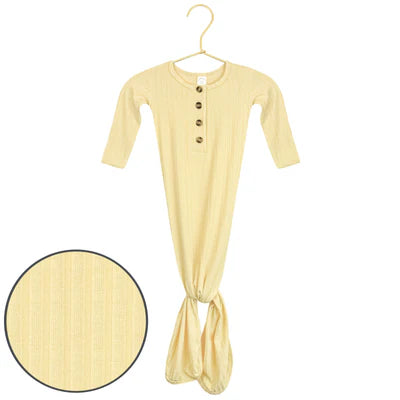 Yellow baby knotted gown on a hanger with close-up of fabric texture.