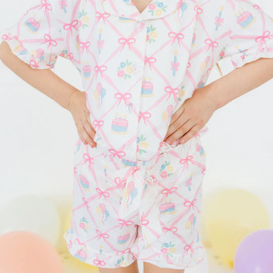 Children's pajama set with colorful patterns on a white background