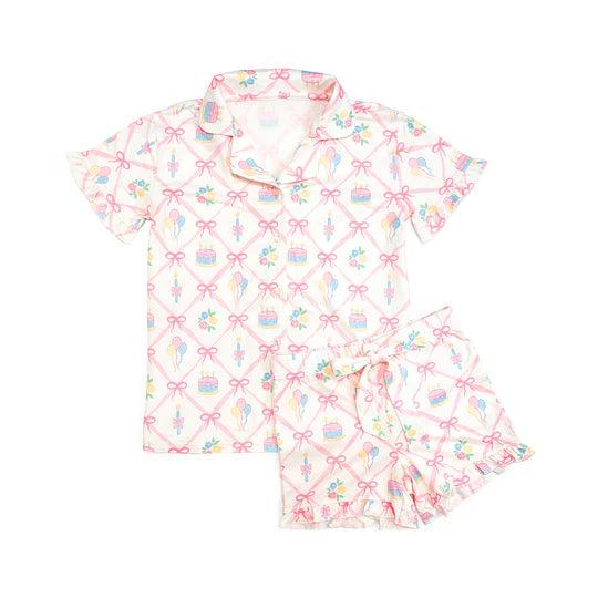 Children's pajama set with colorful pattern on a white background