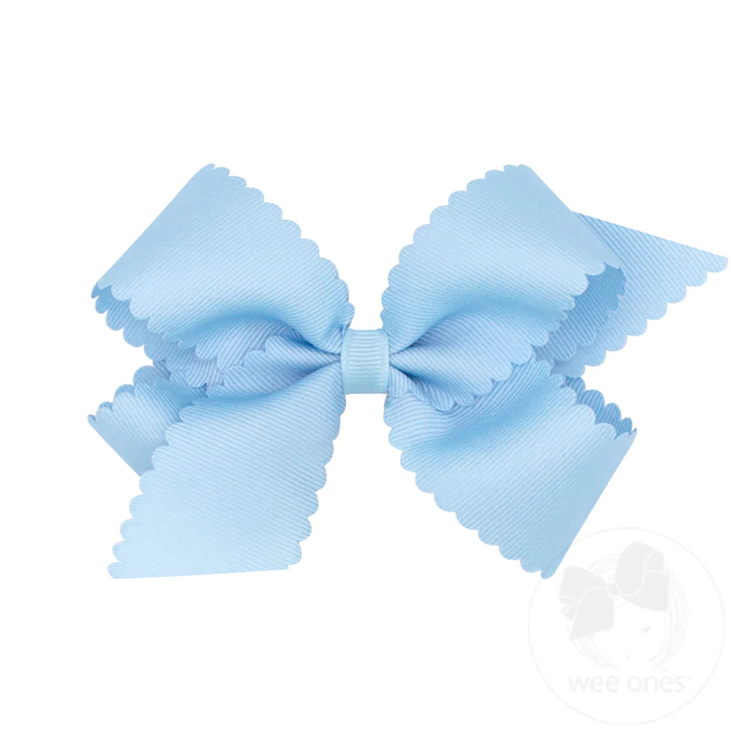 Light blue hair bow on a white background