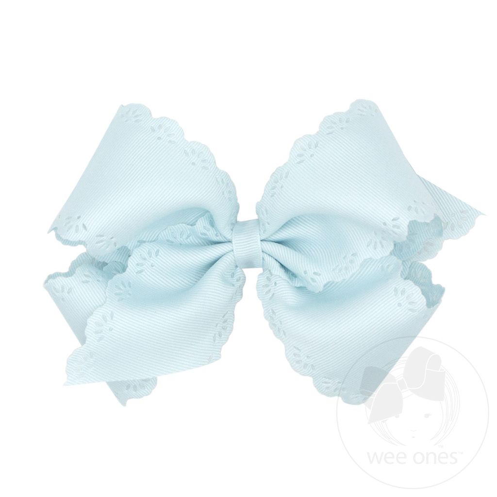 Light blue bow with lace details on a white background