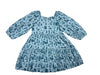A blue long sleeve dress with a western toile theme on a white background.