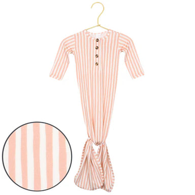 Orange and white striped baby onesie on a hanger with a close-up of the fabric pattern.