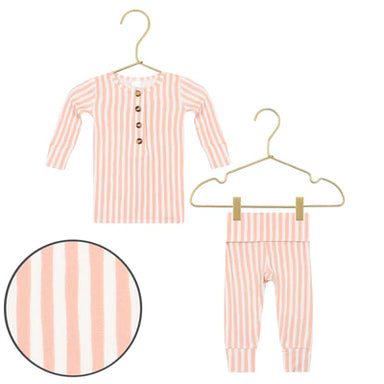 Orange and white striped baby outfit with shirt and pants on hangers against a white background.
