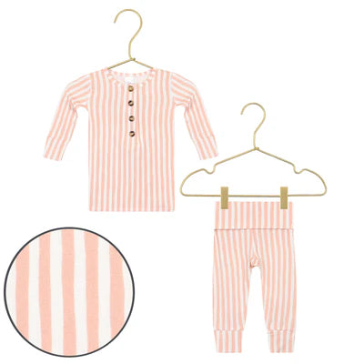 Orange and white striped baby outfit with shirt and pants on hangers against a white background.