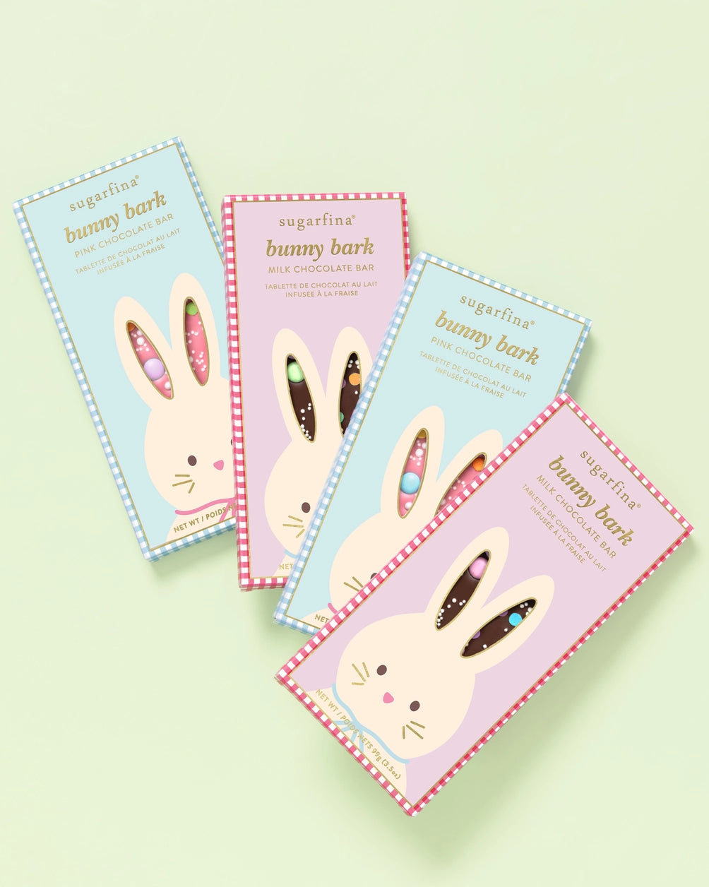 Four packages of 'bunny bark' on a light green background