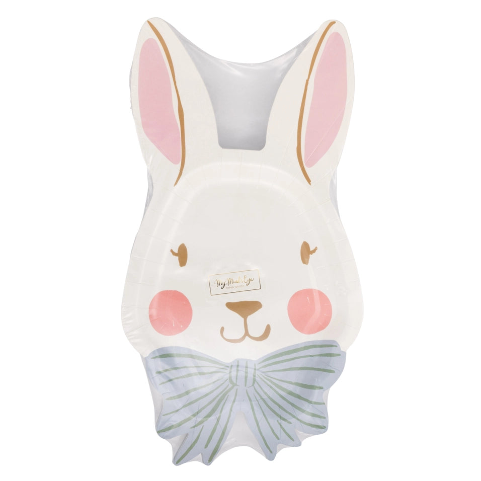 Cushion shaped like a rabbit with a bow tie on a white background