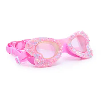 Pink swim goggles with decorative heart design on a white background