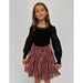 girl wearing pink and silver candy cane sequin striped skirt with elastic waistband 
