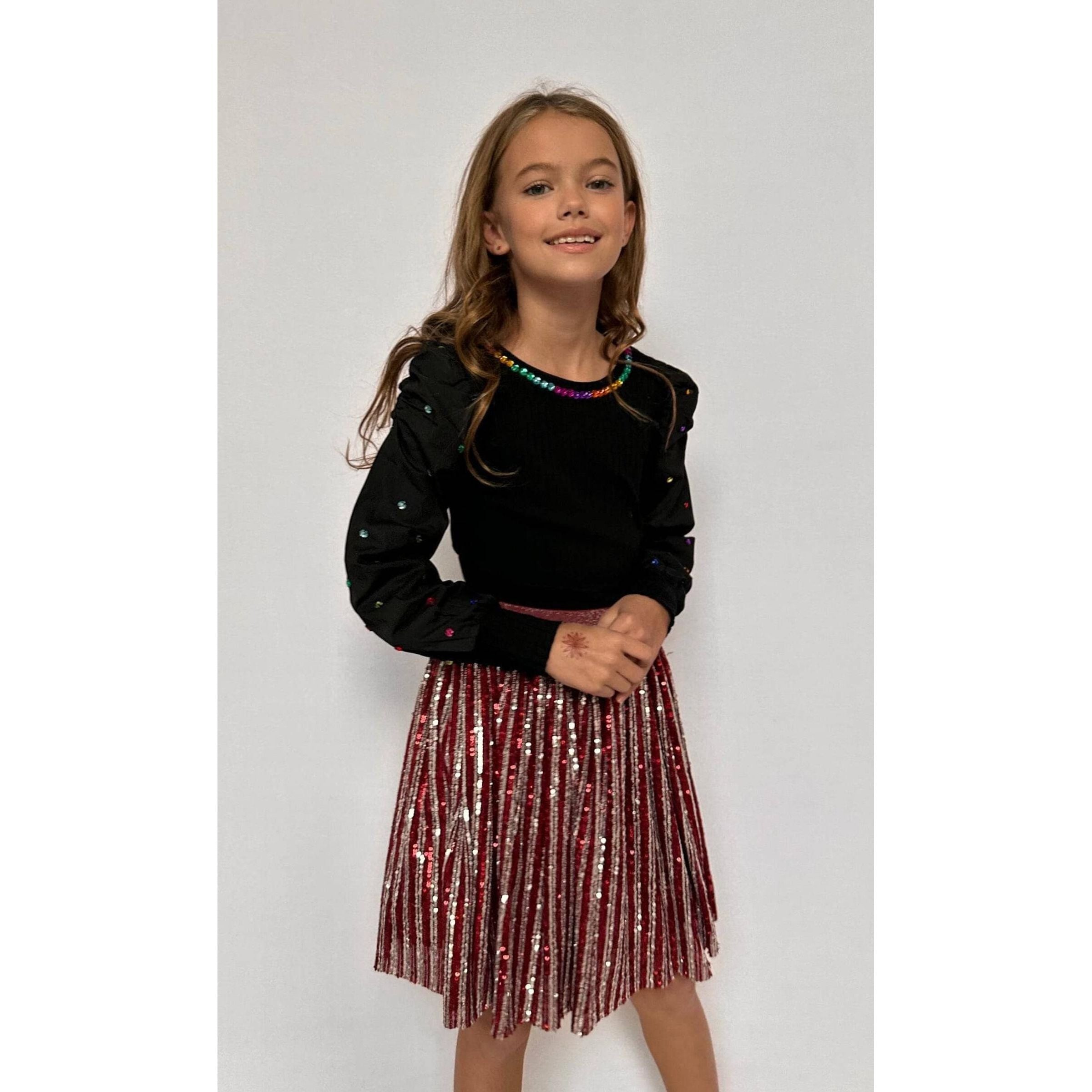 girl wearing pink and silver candy cane sequin striped skirt with elastic waistband