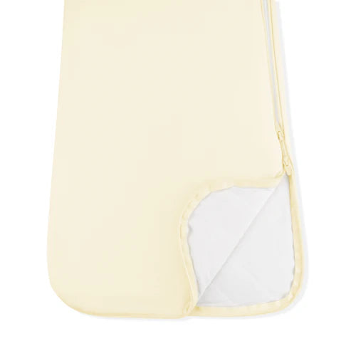 Yellow sleep bagl with white interior on a white background