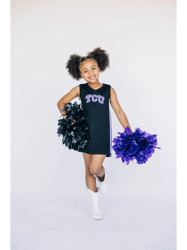 Child in TCU cheerleading outfit with pom-poms on a white background