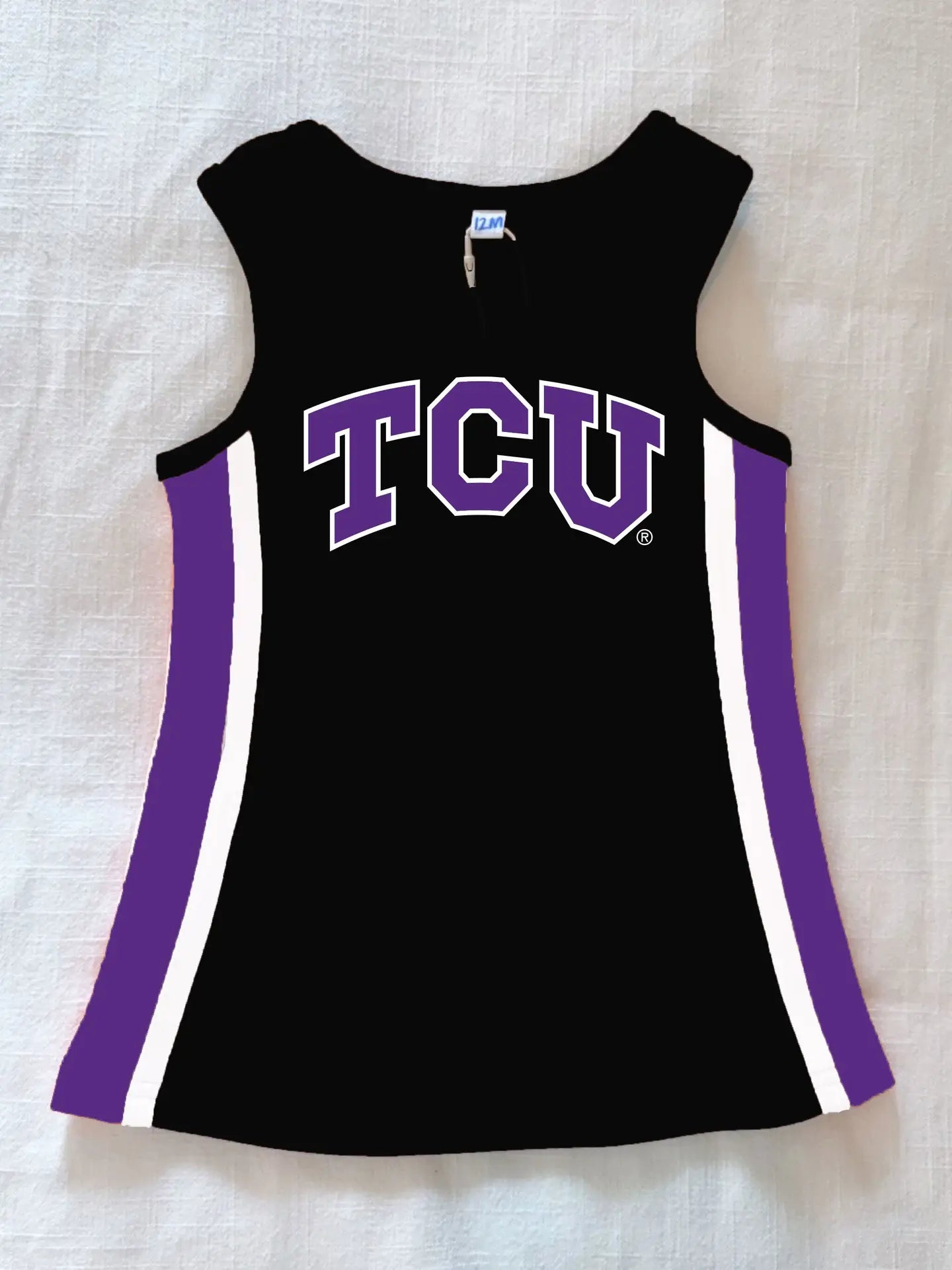 Black sleeveless top with purple accents and 'TCU' logo on a light background