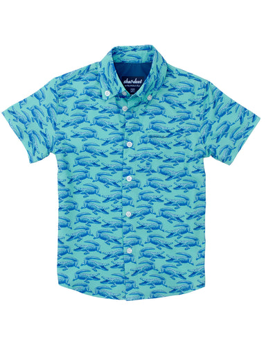 Blue alligator patterned shirt on a white background