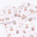 A baby long-sleeve footed sleeper in white with a repeating teddy bear print in muted red, blue, and beige.