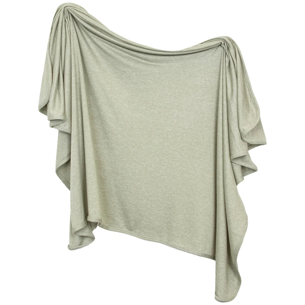 Light sage green draped fabric on a white background
