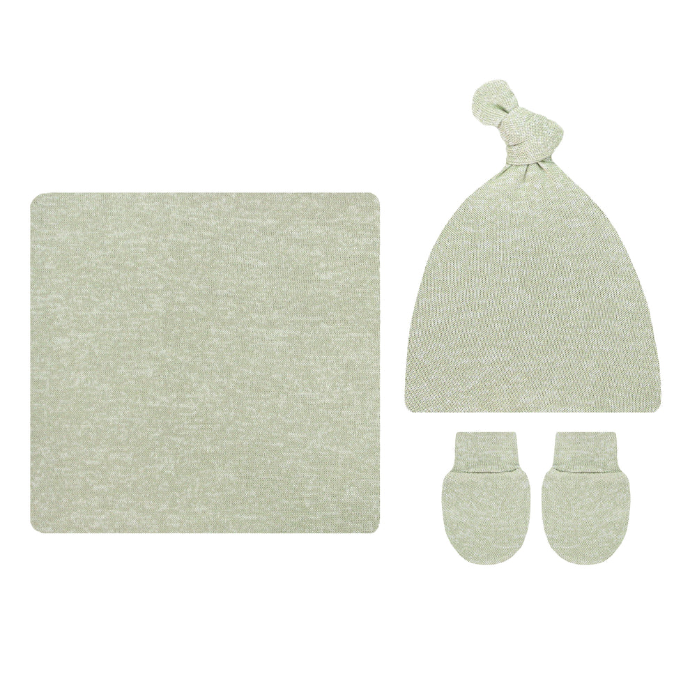 A baby knit gift set in a light sage green heathered fabric, including a square blanket, a knotted beanie hat, and a pair of mittens, arranged on a plain white background.