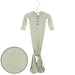 Green baby onesie with buttons on a hanger against a white background
