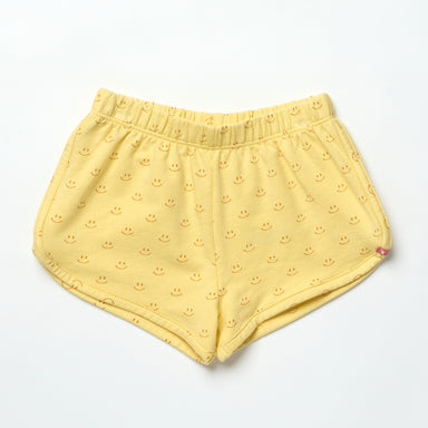Yellow shorts with smiley face pattern on a light gray background