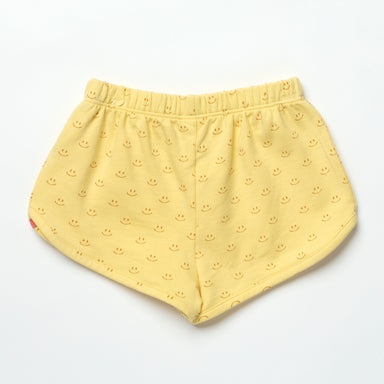 Yellow shorts with smiley face pattern on a white background