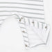 Close-up of a baby garment with white and light gray horizontal stripes, featuring a folded cuff with metal snap buttons on a white background.