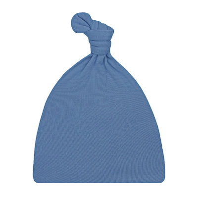 A dusty blue knit baby hat with a knotted top, shown against a plain white background.
