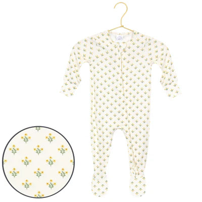 Baby onesie with floral pattern on a hanger against a white background