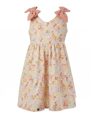 Floral dress held up against a white background