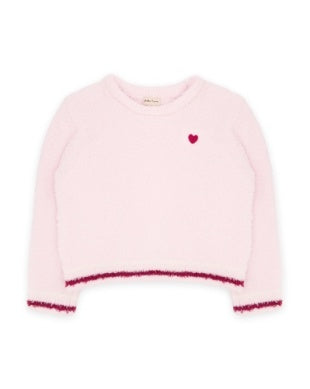 A light pink fuzzy long-sleeve sweater with a small red embroidered heart on the left chest and dark pink fringed trim along the hem and cuffs, shown on a plain white background.