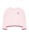 A light pink fuzzy long-sleeve sweater with a small red embroidered heart on the left chest and dark pink fringed trim along the hem and cuffs, shown on a plain white background.