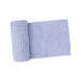 Dusty blue chenille blanket on a white background