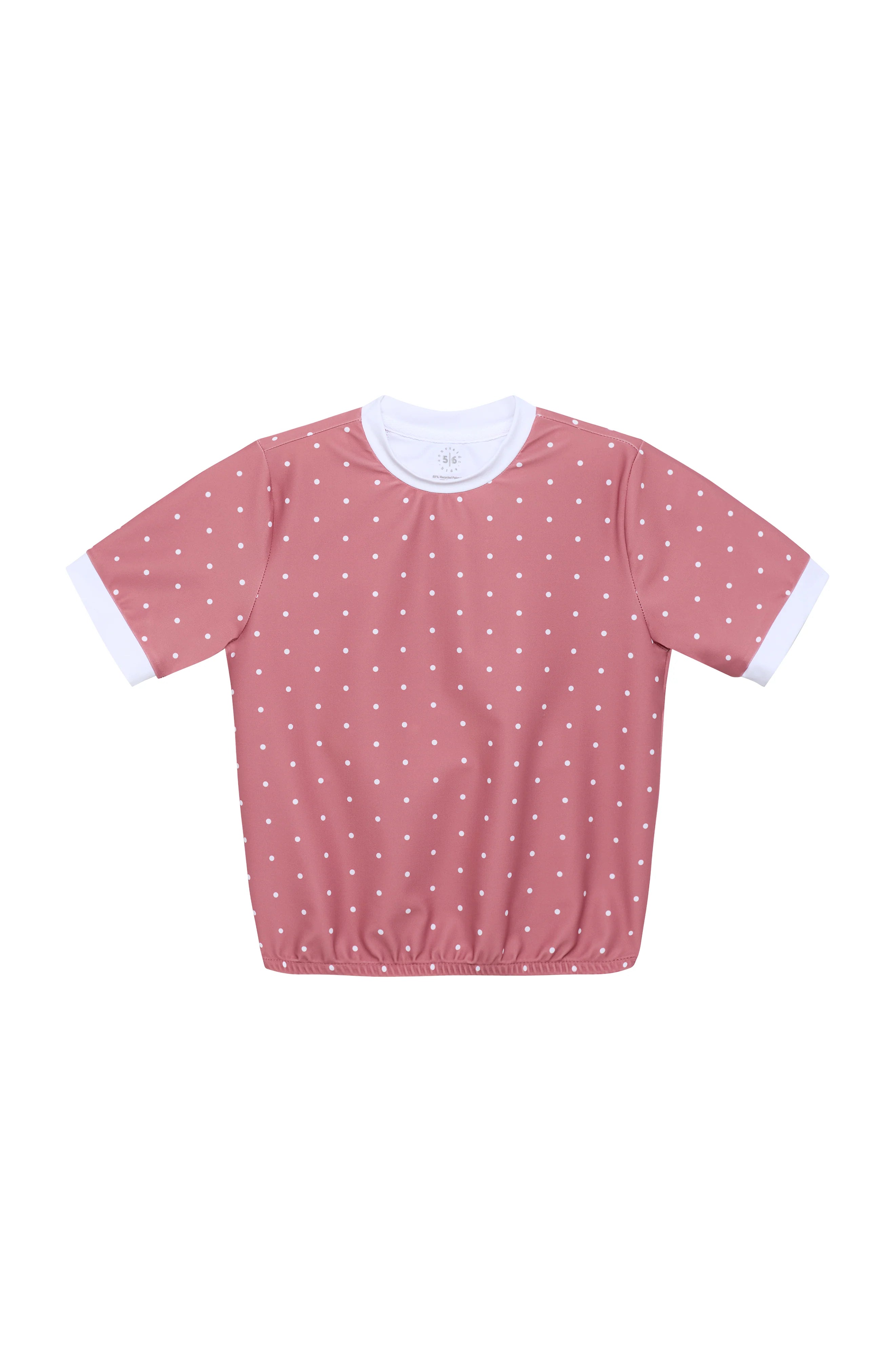 A short-sleeve top in dusty pink with a white polka dot pattern and contrasting white ribbed collar and sleeve cuffs, shown flat on a white background.