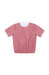 A short-sleeve top in dusty pink with a white polka dot pattern and contrasting white ribbed collar and sleeve cuffs, shown flat on a white background.