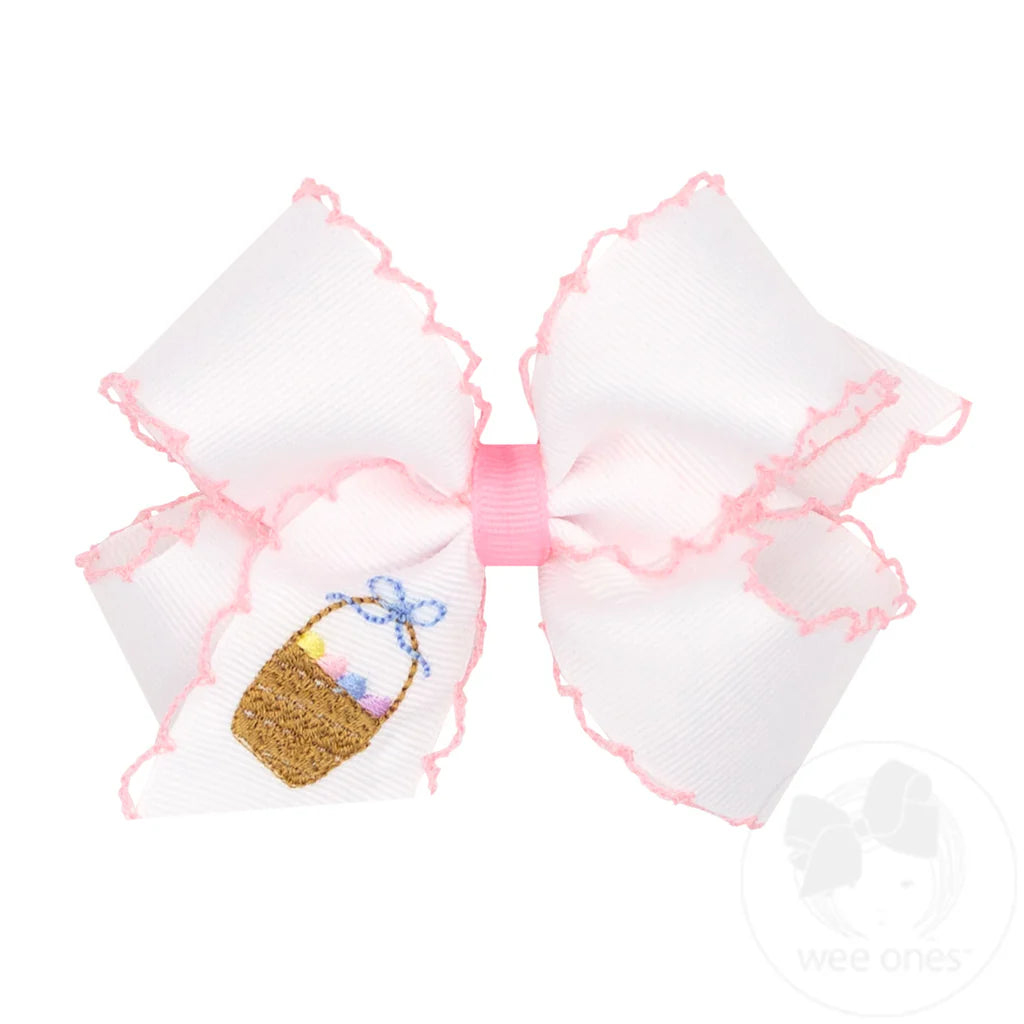 Large white bow with pink edges and a small Easter basket design on a white background