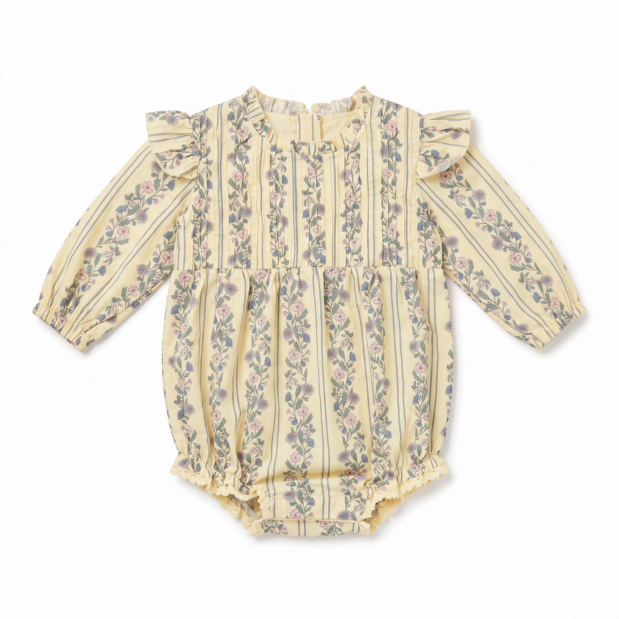 A baby long-sleeve romper in a pale yellowish-beige fabric with vertical stripes and a delicate pink and green floral pattern, featuring ruffled shoulders and a ruffled leg opening.