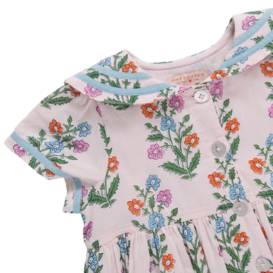 Children's dress with floral pattern on a white background