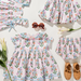 Children's floral dress with matching accessories on a white background