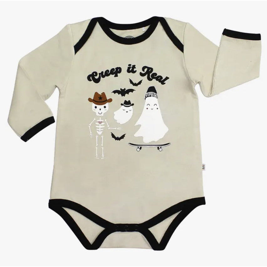 cream onesie with graphic "creep it real"  and skeleton and ghosts