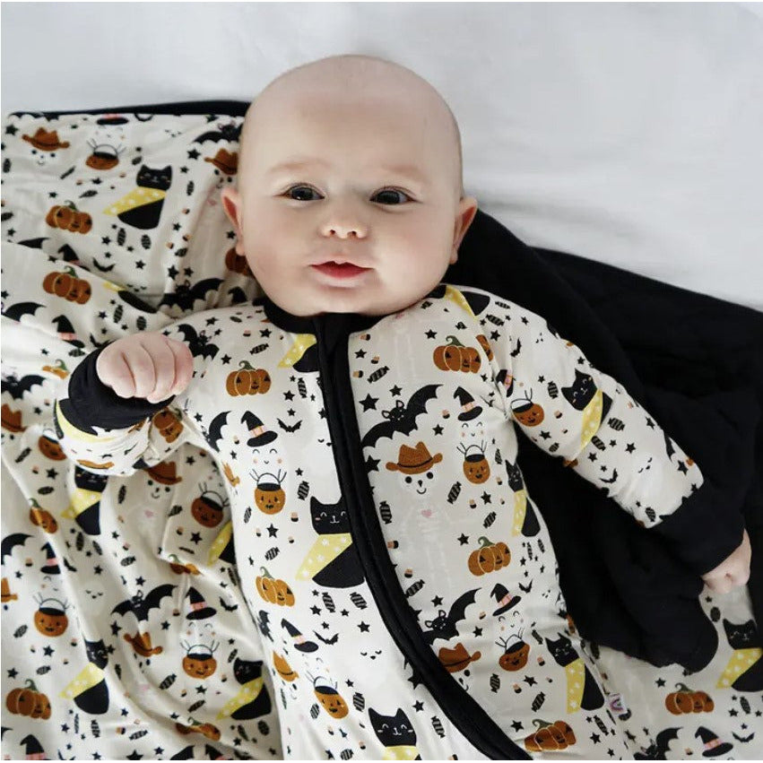 baby wearing long sleeve zipper romper crelong sleeve zipper romper with spooky cute print with cats, skeletons and ghosts