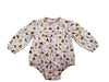 A baby long-sleeve romper in a white fabric with a colorful western-themed print featuring boots, horseshoes, stars, and cowboy hats, displayed flat against a white background.