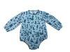 A baby long-sleeve romper in light blue cotton gauze with a dark blue indigo-style print of western motifs like boots, horseshoes, and cacti, shown flat on a white background.