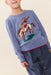 Child wearing a blue Pink Chicken sweater featuring a colorful bucking bronco design with red trim at the cuffs and hem